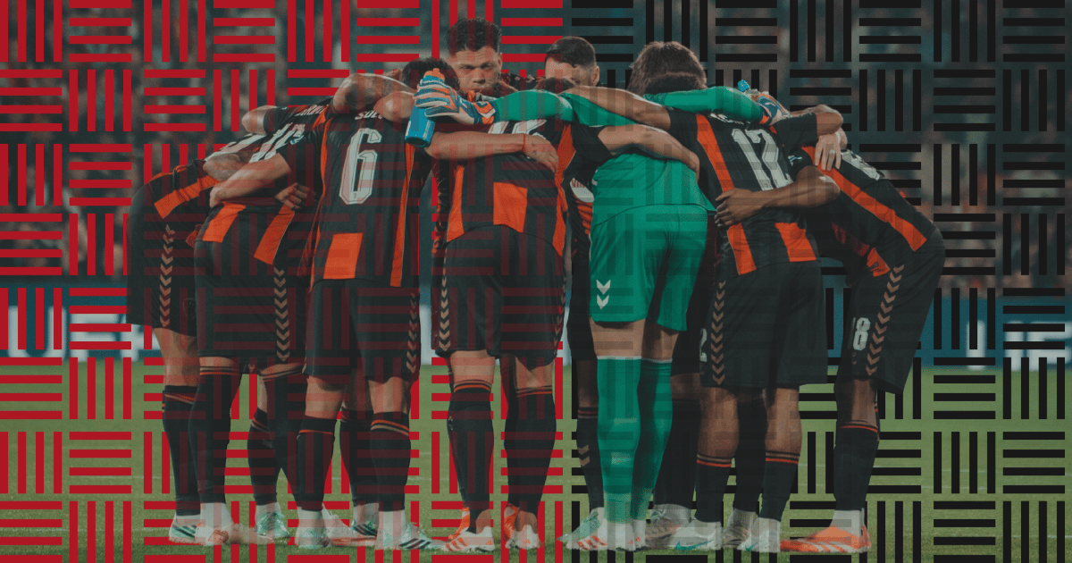 A graphic showcasing the AFC Bournemouth team in a pre-match huddle